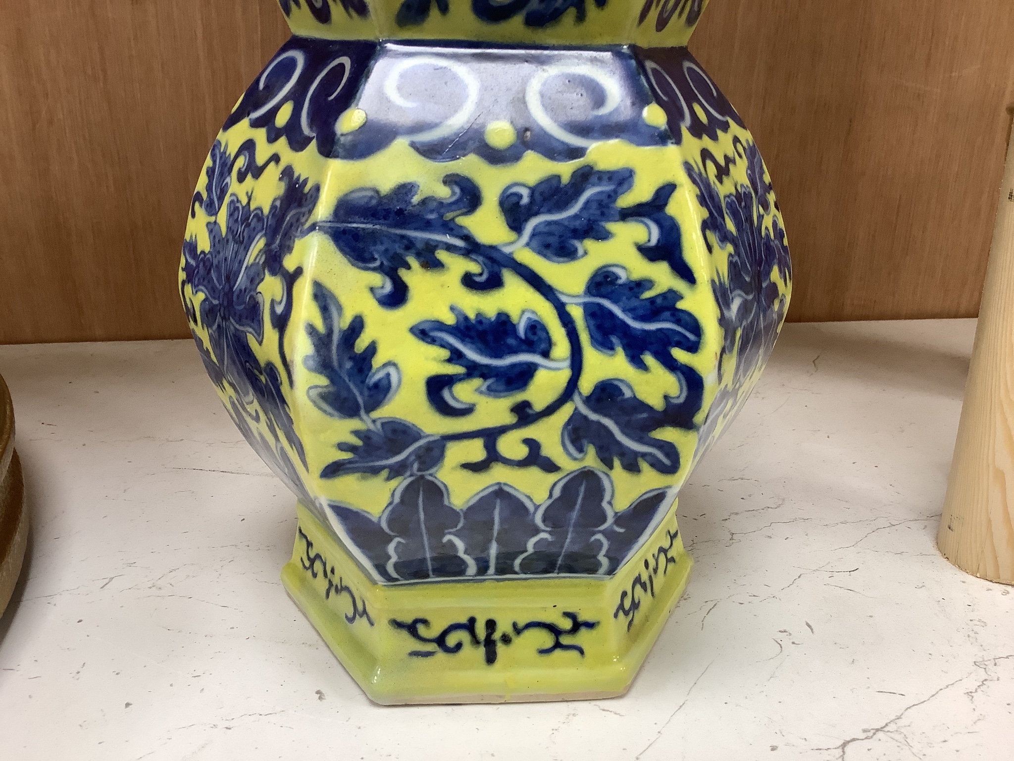 A Chinese underglaze blue yellow ground hexagonal vase, early 20th century, some restoration